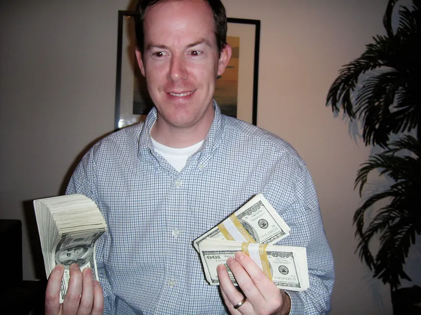 Paul, looking here like a cartel drug lord, withdrew something like $53,000 in cash for Urchin Software Company employees for their Christmas bonuses in 2004. Funny thing is, Google also gave out actual cash money bonuses for years after former Urchin employees joined — millions of dollars in currency. Great minds think alike I guess. This photo was taken on December 17, 2004.